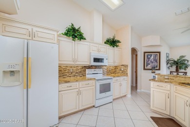 Welcome to this impeccably maintained 4-bedroom, 2-bathroom pool on Spruce Creek Golf Club in Florida - for sale on GolfHomes.com, golf home, golf lot
