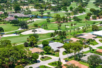 Prime Opportunity to Renovate on Premier Golf on Atlantis Golf Club in Florida - for sale on GolfHomes.com, golf home, golf lot