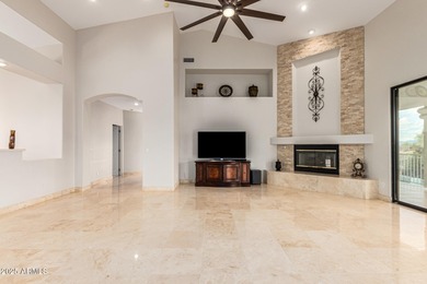 This stunning home is perfectly positioned on the Red Mountain on Red Mountain Ranch Country Club in Arizona - for sale on GolfHomes.com, golf home, golf lot