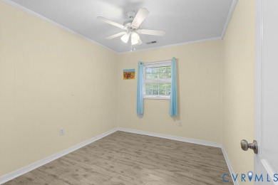 A short walk from the striking Piankatank River, this charming on Piankatank River Golf Club in Virginia - for sale on GolfHomes.com, golf home, golf lot