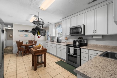 Coastal breezes, golf cart rides, and laid-back beach living on Tupelo Bay Golf Complex  in South Carolina - for sale on GolfHomes.com, golf home, golf lot