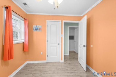 A short walk from the striking Piankatank River, this charming on Piankatank River Golf Club in Virginia - for sale on GolfHomes.com, golf home, golf lot