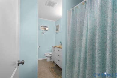 A short walk from the striking Piankatank River, this charming on Piankatank River Golf Club in Virginia - for sale on GolfHomes.com, golf home, golf lot