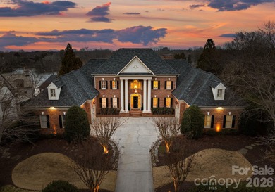 Stunning lakefront home in the exclusive gated community of on Carmel Country Club in North Carolina - for sale on GolfHomes.com, golf home, golf lot