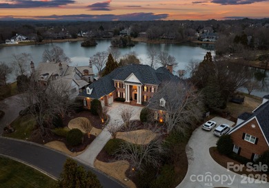 Stunning lakefront home in the exclusive gated community of on Carmel Country Club in North Carolina - for sale on GolfHomes.com, golf home, golf lot