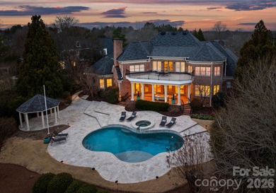 Stunning lakefront home in the exclusive gated community of on Carmel Country Club in North Carolina - for sale on GolfHomes.com, golf home, golf lot