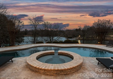 Stunning lakefront home in the exclusive gated community of on Carmel Country Club in North Carolina - for sale on GolfHomes.com, golf home, golf lot