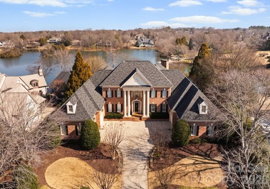 Stunning lakefront home in the exclusive gated community of on Carmel Country Club in North Carolina - for sale on GolfHomes.com, golf home, golf lot