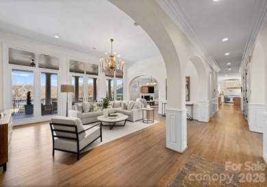 Stunning lakefront home in the exclusive gated community of on Carmel Country Club in North Carolina - for sale on GolfHomes.com, golf home, golf lot