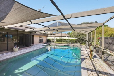 Welcome to this Beautiful Corner-Lot Ranch-Style Pool Home in on East Lake Woodlands Country Club in Florida - for sale on GolfHomes.com, golf home, golf lot