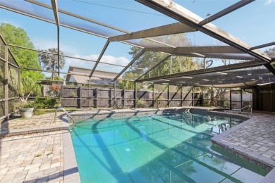 Welcome to this Beautiful Corner-Lot Ranch-Style Pool Home in on East Lake Woodlands Country Club in Florida - for sale on GolfHomes.com, golf home, golf lot