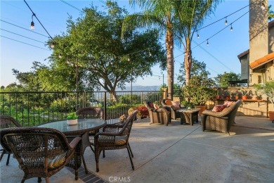 A wonderful home nestled high in the hills of Anaheim surrounded on Anaheim Hills Golf Course in California - for sale on GolfHomes.com, golf home, golf lot