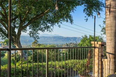 A wonderful home nestled high in the hills of Anaheim surrounded on Anaheim Hills Golf Course in California - for sale on GolfHomes.com, golf home, golf lot