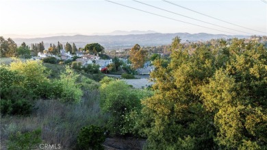 A wonderful home nestled high in the hills of Anaheim surrounded on Anaheim Hills Golf Course in California - for sale on GolfHomes.com, golf home, golf lot