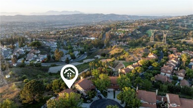 A wonderful home nestled high in the hills of Anaheim surrounded on Anaheim Hills Golf Course in California - for sale on GolfHomes.com, golf home, golf lot