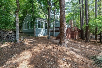 Stunning water views from this one-of-a-kind waterfront retreat on Holly Lake Ranch Golf Club in Texas - for sale on GolfHomes.com, golf home, golf lot