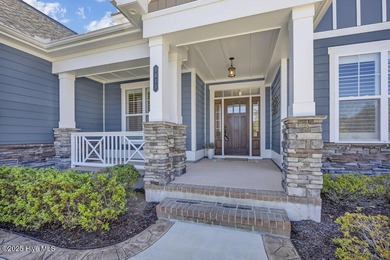Exceptional curb appeal defines this beautifully designed on Cape Fear National At Brunswick Forest in North Carolina - for sale on GolfHomes.com, golf home, golf lot