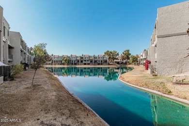 Stunning tri-level, gated waterfront townhome in Dobson Ranch's on Dobson Ranch Municipal Golf Course in Arizona - for sale on GolfHomes.com, golf home, golf lot