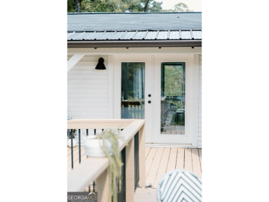 Step inside this one-of-a-kind mid-century home overlooking on Newnan Country Club in Georgia - for sale on GolfHomes.com, golf home, golf lot