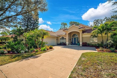 Indulge in unparalleled views of the tranquil lake and verdant on Calusa Lakes Golf Club in Florida - for sale on GolfHomes.com, golf home, golf lot
