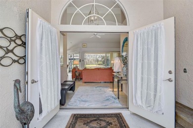Indulge in unparalleled views of the tranquil lake and verdant on Calusa Lakes Golf Club in Florida - for sale on GolfHomes.com, golf home, golf lot