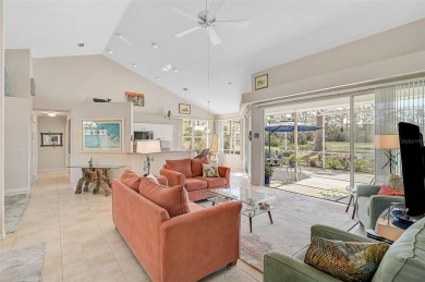 Indulge in unparalleled views of the tranquil lake and verdant on Calusa Lakes Golf Club in Florida - for sale on GolfHomes.com, golf home, golf lot
