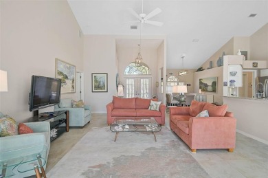 Indulge in unparalleled views of the tranquil lake and verdant on Calusa Lakes Golf Club in Florida - for sale on GolfHomes.com, golf home, golf lot