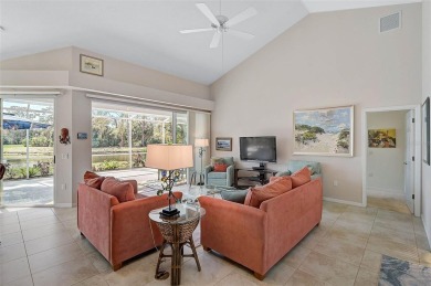 Indulge in unparalleled views of the tranquil lake and verdant on Calusa Lakes Golf Club in Florida - for sale on GolfHomes.com, golf home, golf lot