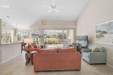 Indulge in unparalleled views of the tranquil lake and verdant on Calusa Lakes Golf Club in Florida - for sale on GolfHomes.com, golf home, golf lot