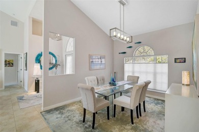 Indulge in unparalleled views of the tranquil lake and verdant on Calusa Lakes Golf Club in Florida - for sale on GolfHomes.com, golf home, golf lot