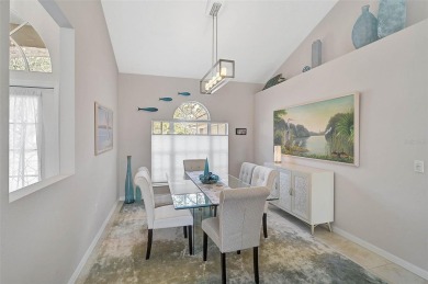 Indulge in unparalleled views of the tranquil lake and verdant on Calusa Lakes Golf Club in Florida - for sale on GolfHomes.com, golf home, golf lot