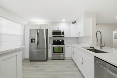 Step into this fully updated, move-in-ready gem in the highly on Wynmoor Golf Course in Florida - for sale on GolfHomes.com, golf home, golf lot