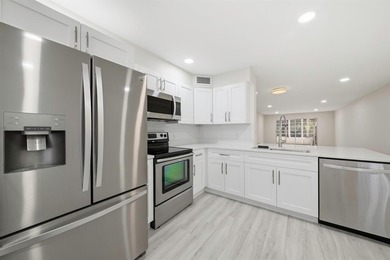 Step into this fully updated, move-in-ready gem in the highly on Wynmoor Golf Course in Florida - for sale on GolfHomes.com, golf home, golf lot