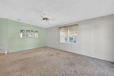 Located in beautiful Fox Run, this 2-bedroom 2-bath home on Bay Tree Golf Course in Florida - for sale on GolfHomes.com, golf home, golf lot