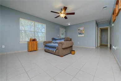 Nestled beneath large shade oak trees, this fully furnished on Rockport Country Club in Texas - for sale on GolfHomes.com, golf home, golf lot