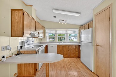 Located in beautiful Fox Run, this 2-bedroom 2-bath home on Bay Tree Golf Course in Florida - for sale on GolfHomes.com, golf home, golf lot