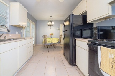 Nestled beneath large shade oak trees, this fully furnished on Rockport Country Club in Texas - for sale on GolfHomes.com, golf home, golf lot