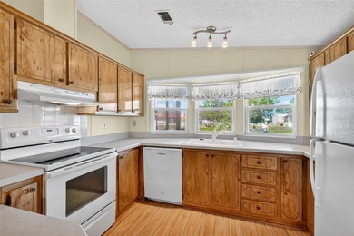 Located in beautiful Fox Run, this 2-bedroom 2-bath home on Bay Tree Golf Course in Florida - for sale on GolfHomes.com, golf home, golf lot