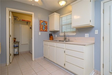 Nestled beneath large shade oak trees, this fully furnished on Rockport Country Club in Texas - for sale on GolfHomes.com, golf home, golf lot