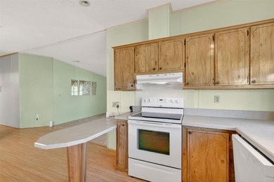 Located in beautiful Fox Run, this 2-bedroom 2-bath home on Bay Tree Golf Course in Florida - for sale on GolfHomes.com, golf home, golf lot