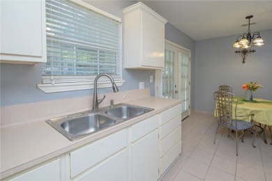 Nestled beneath large shade oak trees, this fully furnished on Rockport Country Club in Texas - for sale on GolfHomes.com, golf home, golf lot