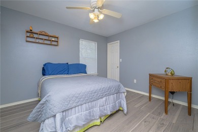 Nestled beneath large shade oak trees, this fully furnished on Rockport Country Club in Texas - for sale on GolfHomes.com, golf home, golf lot