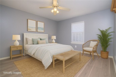 Nestled beneath large shade oak trees, this fully furnished on Rockport Country Club in Texas - for sale on GolfHomes.com, golf home, golf lot