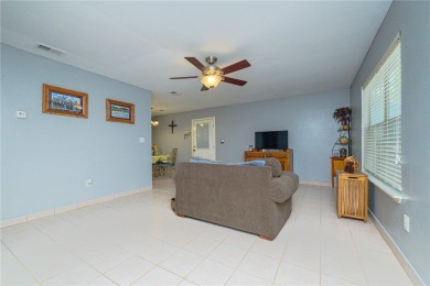 Nestled beneath large shade oak trees, this fully furnished on Rockport Country Club in Texas - for sale on GolfHomes.com, golf home, golf lot