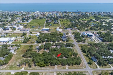 Nestled beneath large shade oak trees, this fully furnished on Rockport Country Club in Texas - for sale on GolfHomes.com, golf home, golf lot
