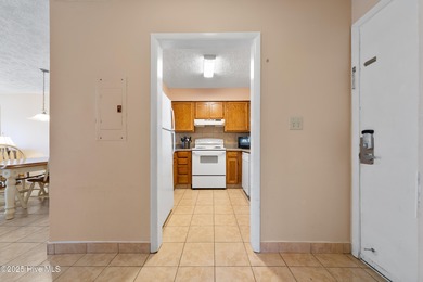 Your slice of paradise awaits! This tastefully furnished on Oak Island Golf Club in North Carolina - for sale on GolfHomes.com, golf home, golf lot