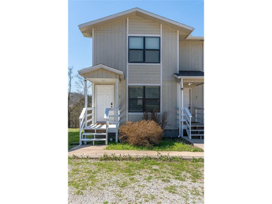 This 2-bedroom, 1.5-bathroom condo overlooks the pristine waters on Holiday Island Executive Golf Course in Arkansas - for sale on GolfHomes.com, golf home, golf lot