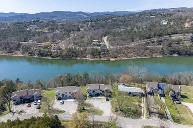 This 2-bedroom, 1.5-bathroom condo overlooks the pristine waters on Holiday Island Executive Golf Course in Arkansas - for sale on GolfHomes.com, golf home, golf lot