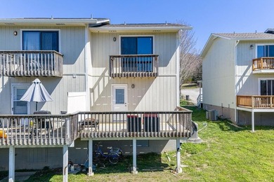 This 2-bedroom, 1.5-bathroom condo overlooks the pristine waters on Holiday Island Executive Golf Course in Arkansas - for sale on GolfHomes.com, golf home, golf lot