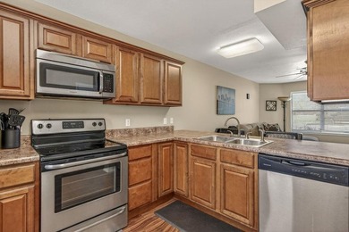 This 2-bedroom, 1.5-bathroom condo overlooks the pristine waters on Holiday Island Executive Golf Course in Arkansas - for sale on GolfHomes.com, golf home, golf lot